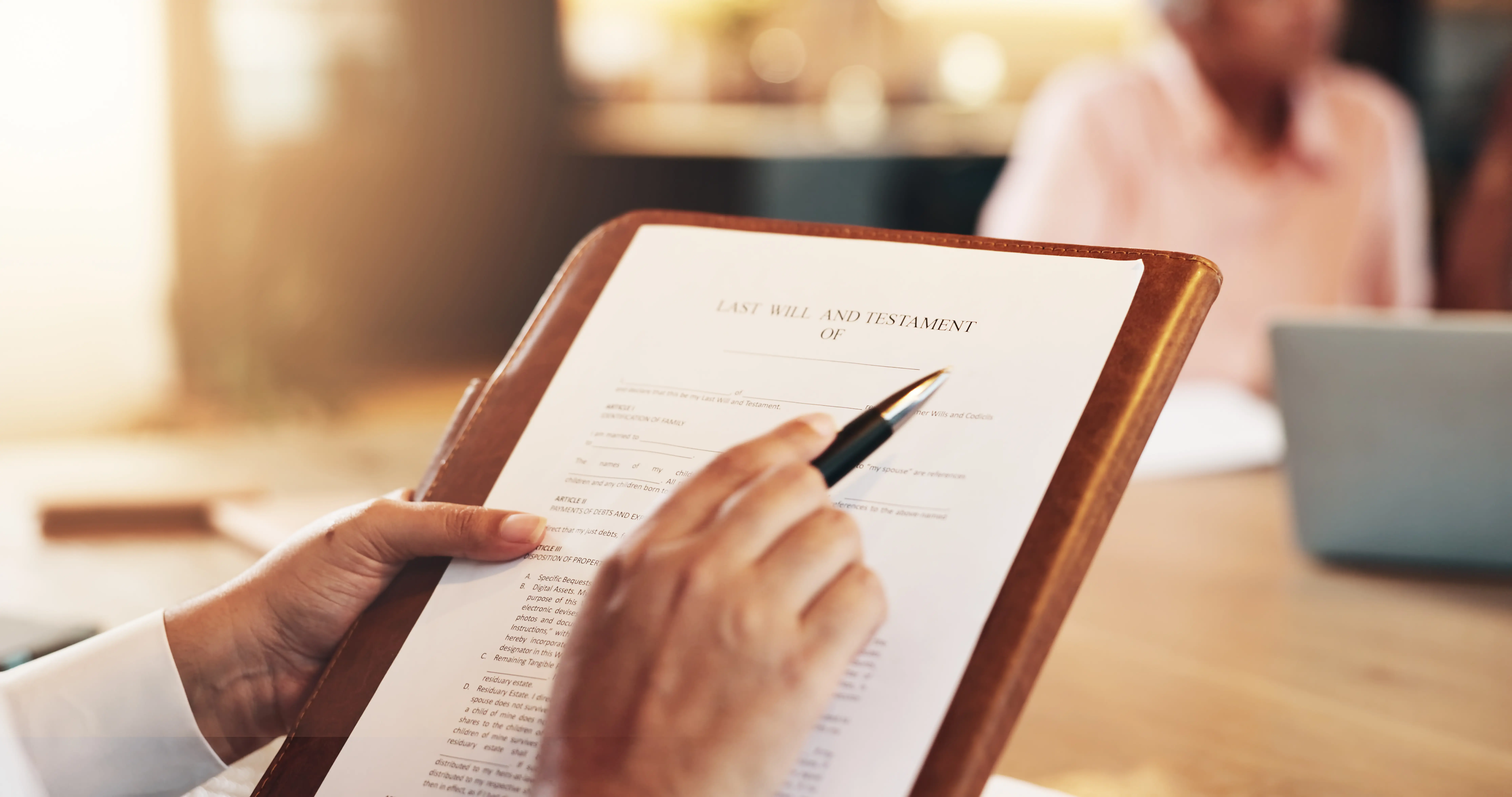 Signing a will on a clipboard